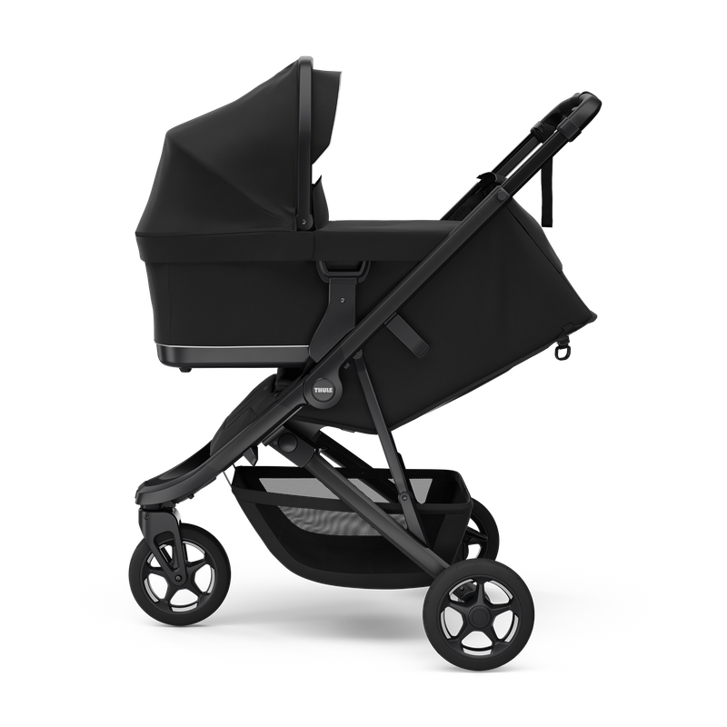 Thule Spring 2 stroller Black on Black, folded and self-standing