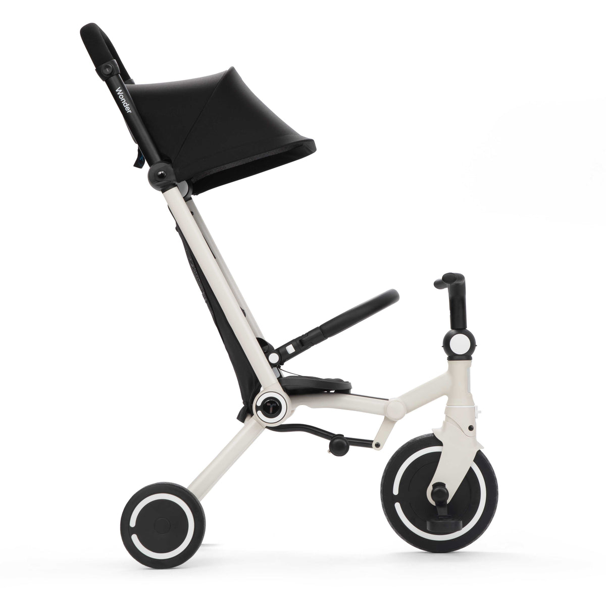 smarTrike Wonder Moonlight in trike mode, child holds handlebars while parent steers