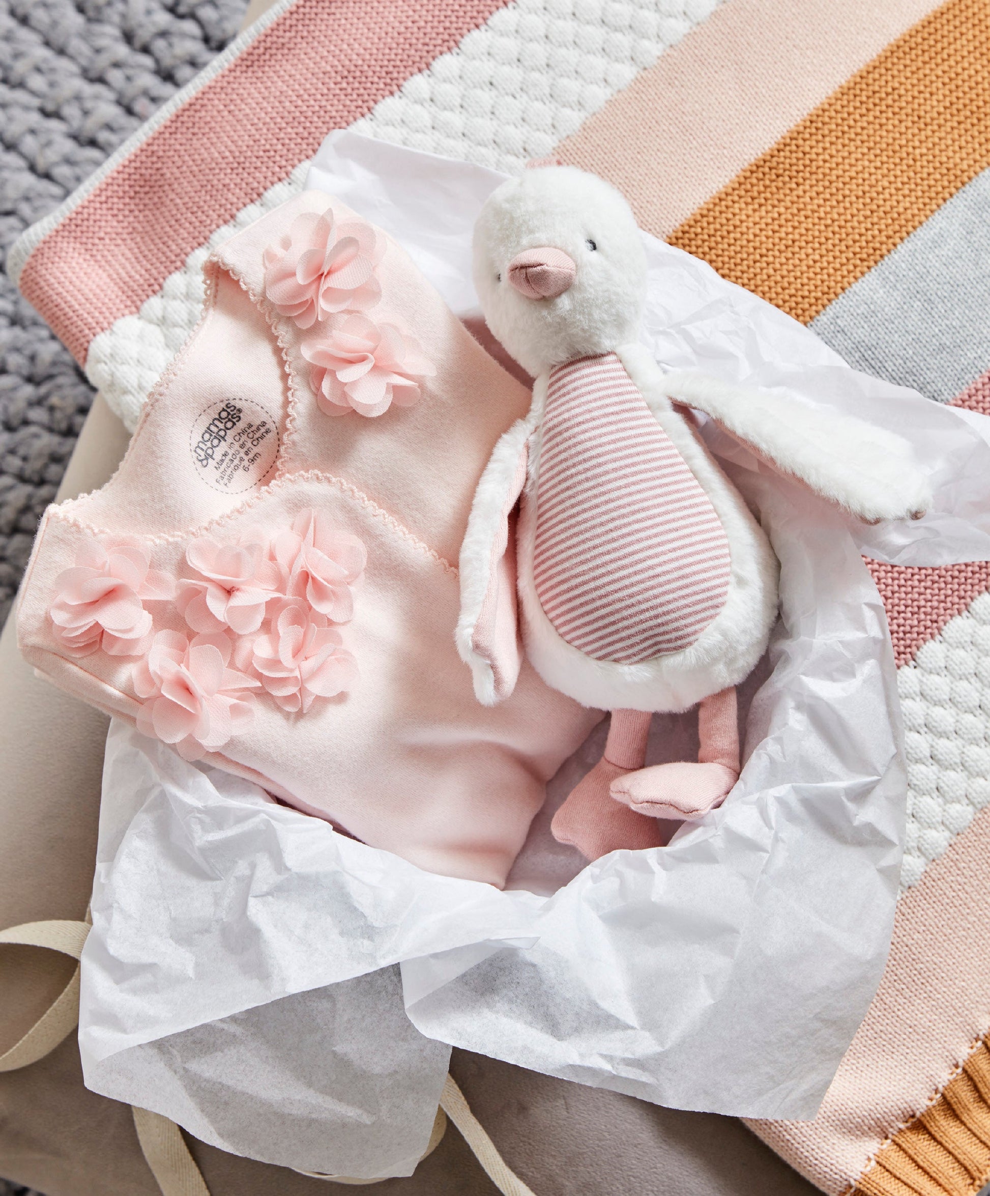 WTTW Chime Duck Pink — styled on pram bar, soft fabric with chime bell, Mamas & Papas