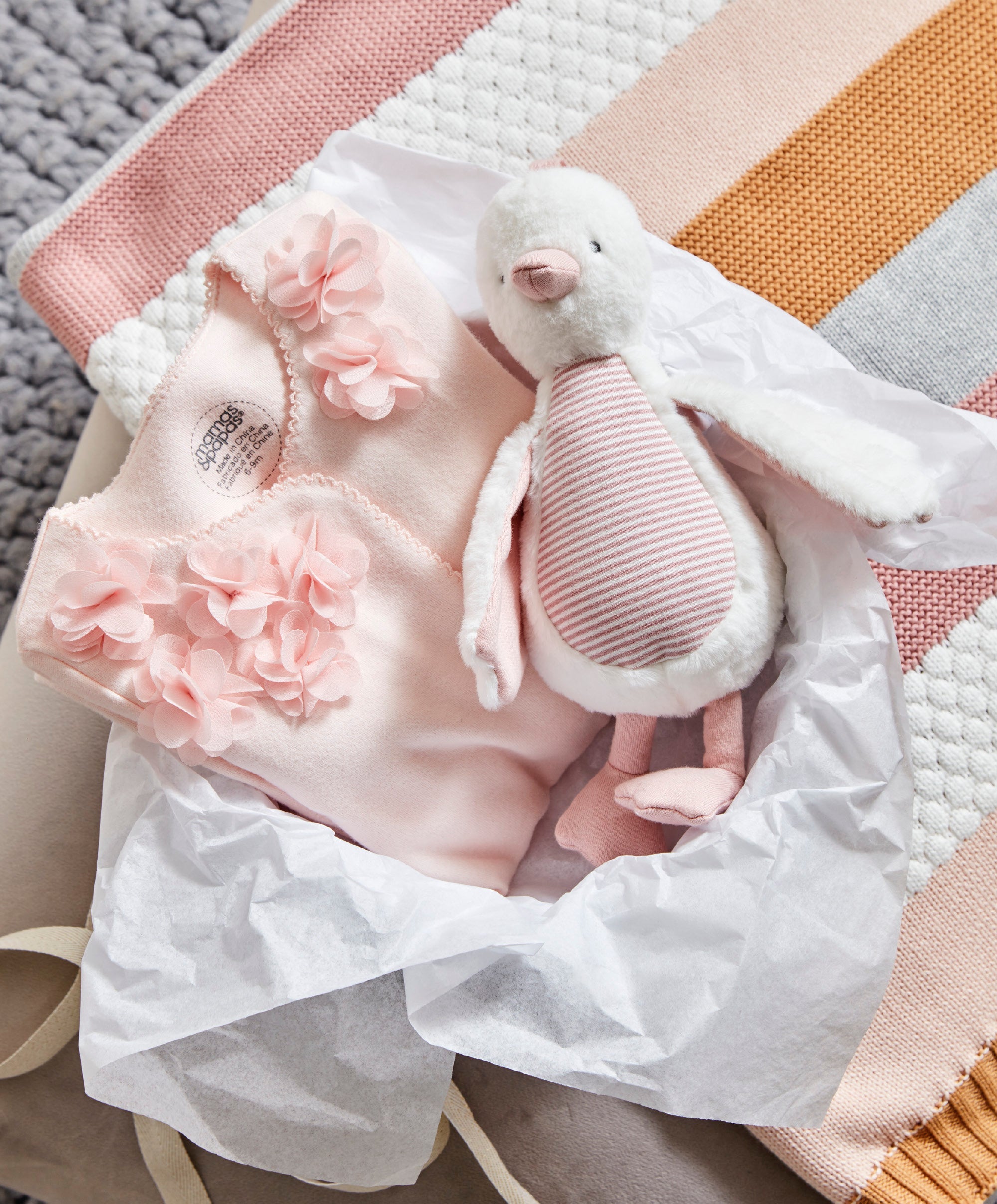 WTTW Chime Duck Pink — styled on pram bar, soft fabric with chime bell, Mamas & Papas