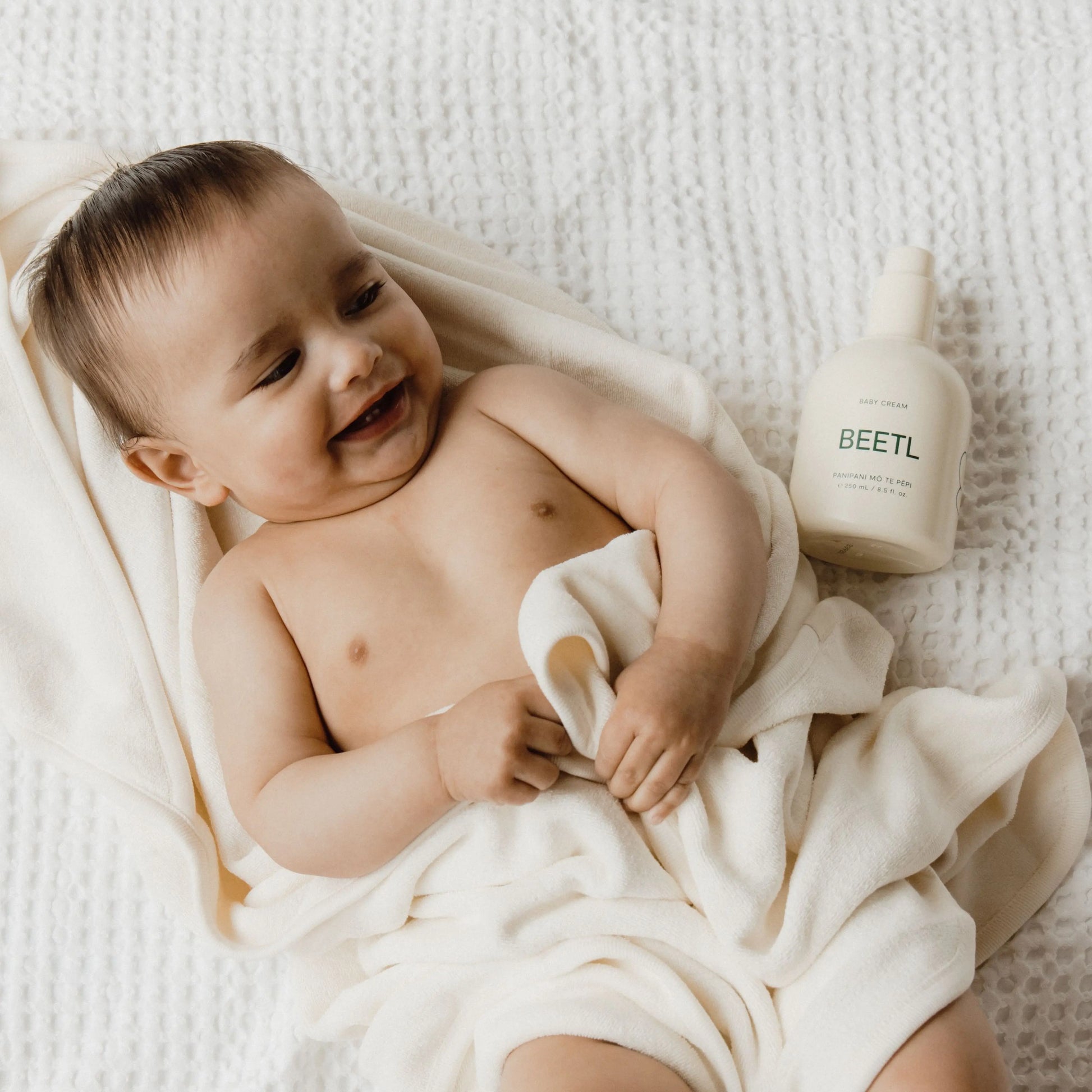 BEETL Baby Cream being applied to baby's face
