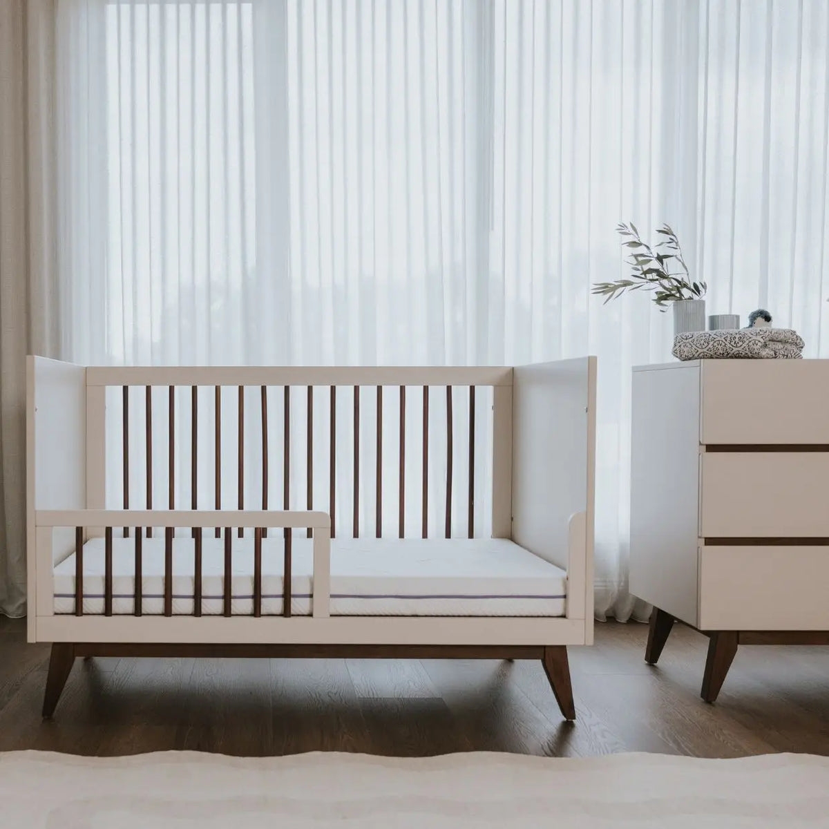 Babyrest Hugo Cot converted to a junior bed with the bedrail