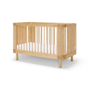 Babyrest Juno Cot in Ash – reeded detailing and brass accents