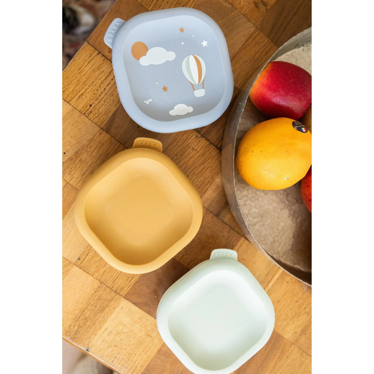 Baby eating from a Beaba stainless steel bowl