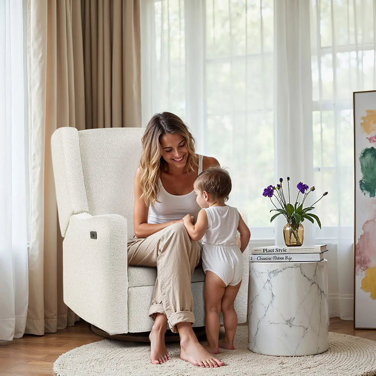 COCOON BONDI Vanilla Boucle nursery glider — angled view showing electric recline and White Ash swivel base