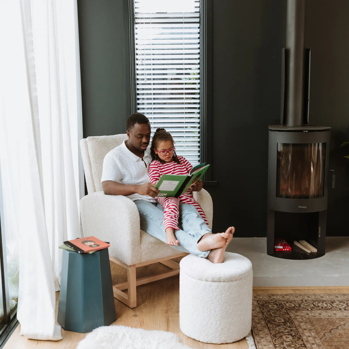 Dad and daughter on the Cariboo Myla chair and Mylo ottoman
