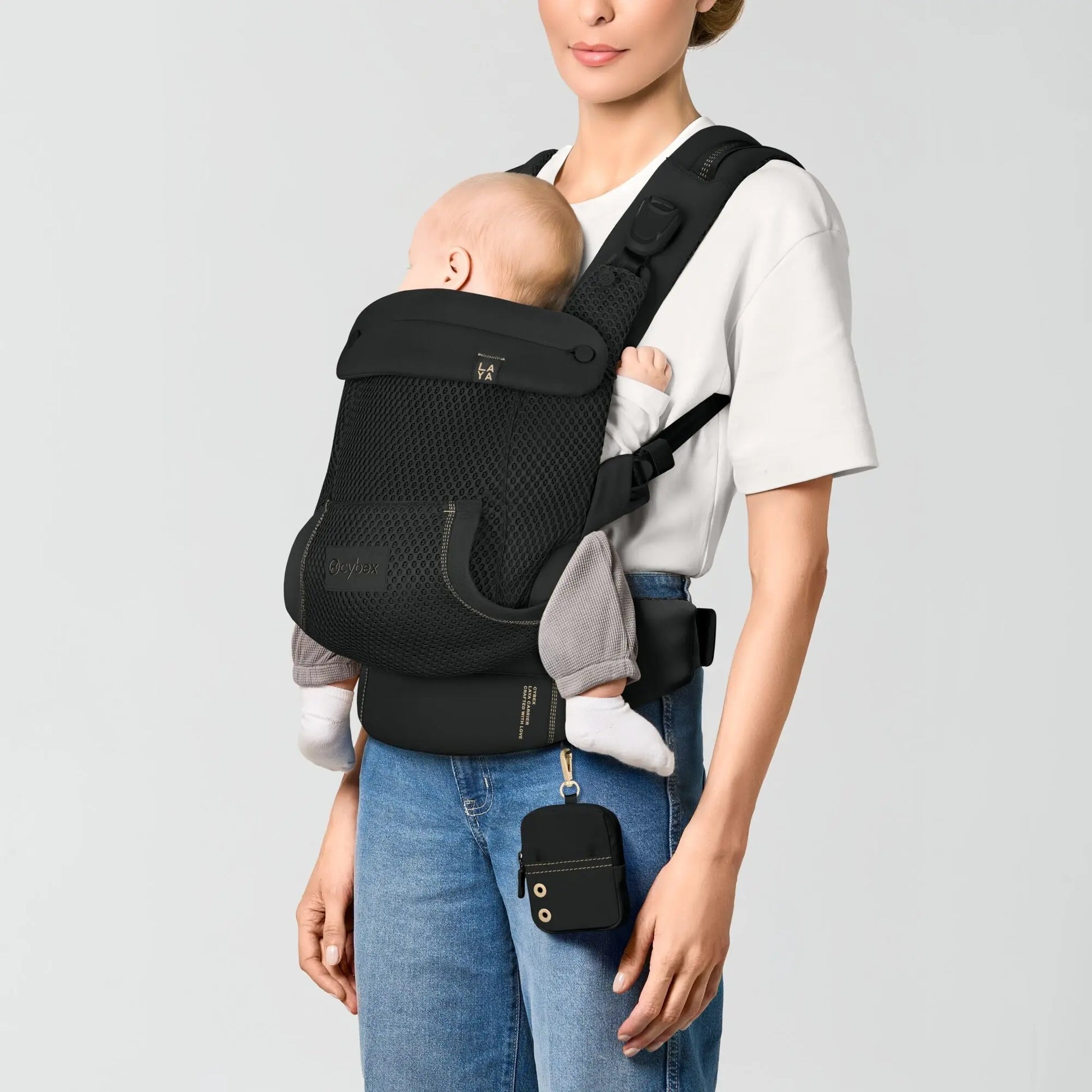 Front inward carry position with an older baby in the Laya carrier, Magic Black