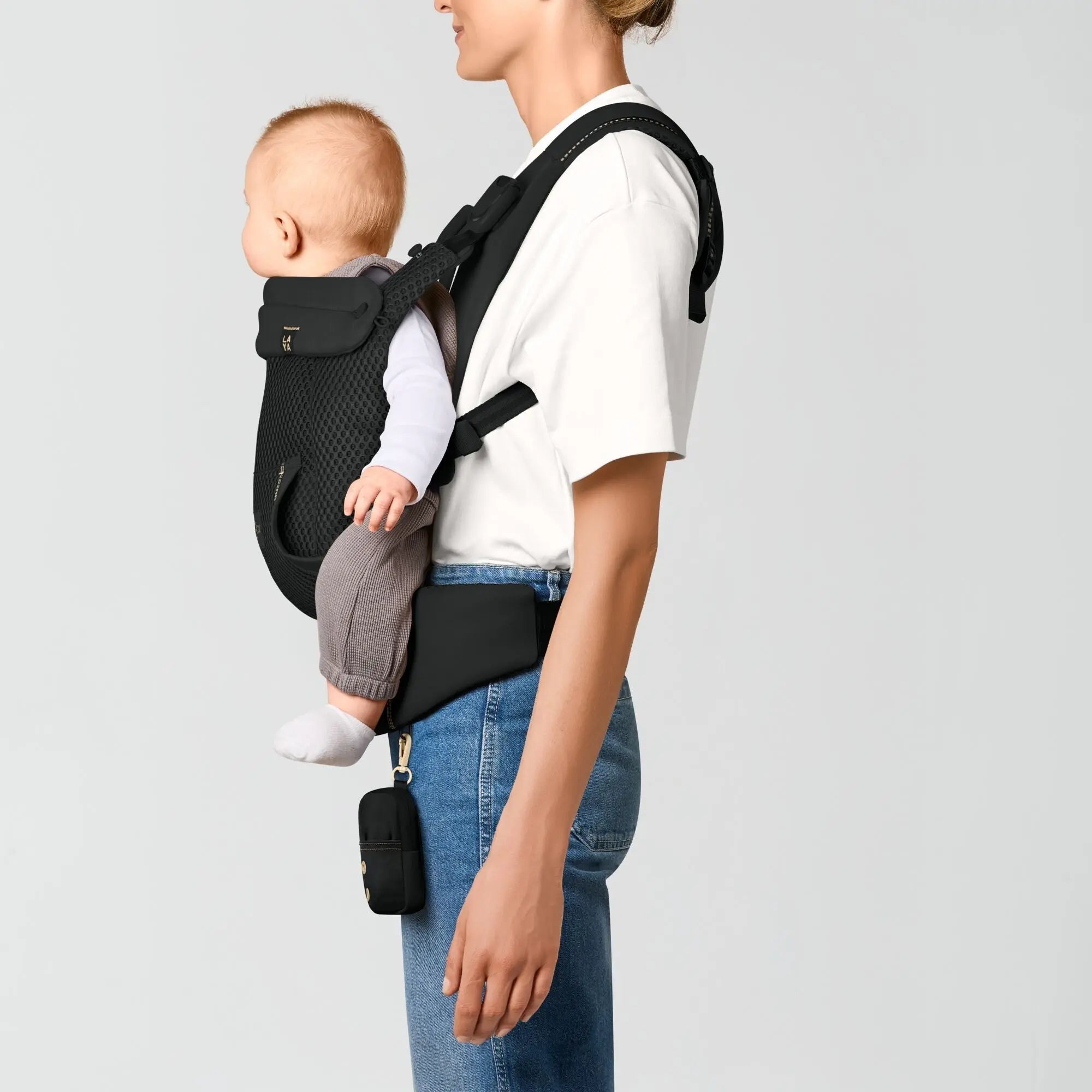 Baby facing the world in the Laya carrier front outward carry position