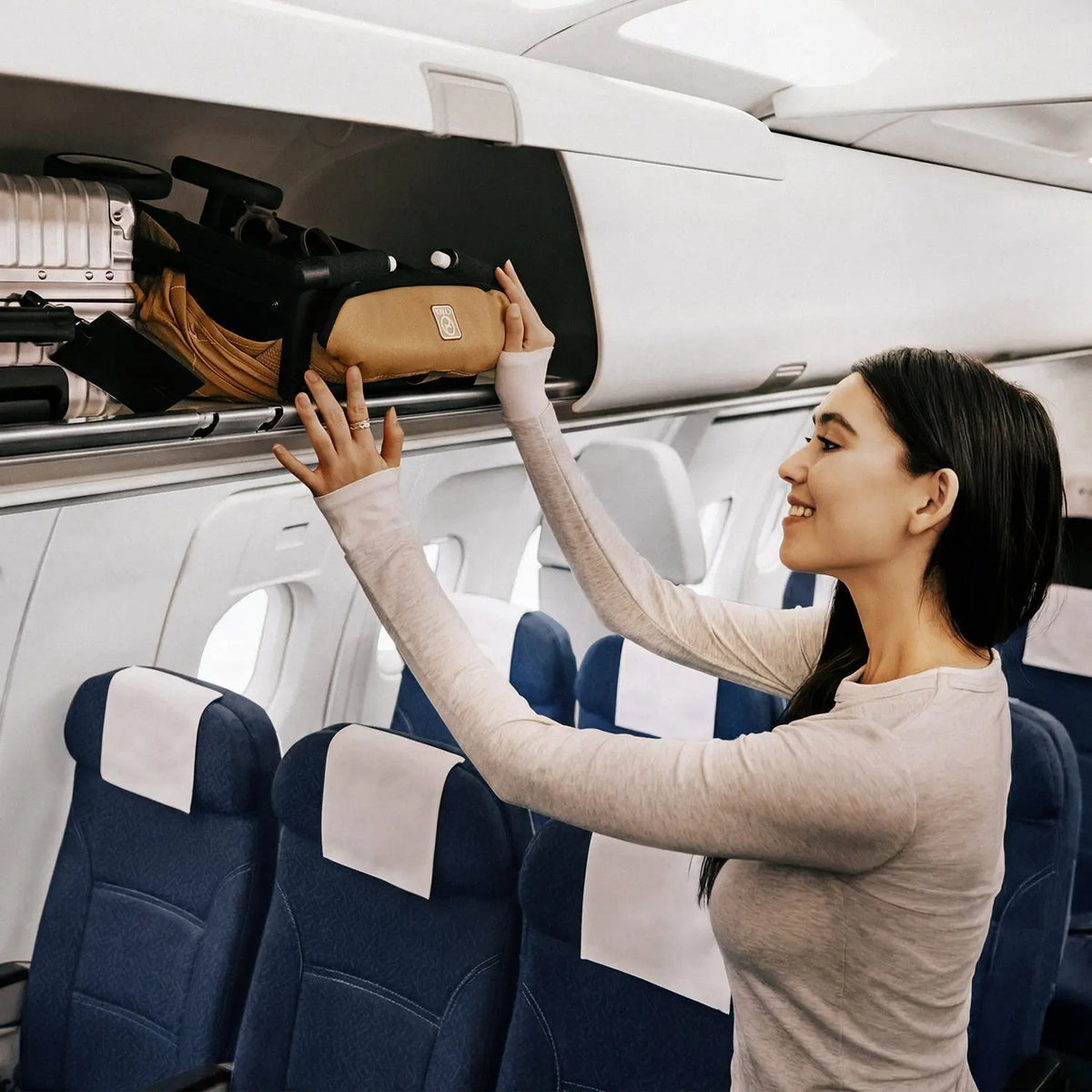 Cybex Libelle compact fold small enough for the overhead locker (shown in Cinnamon Yellow)