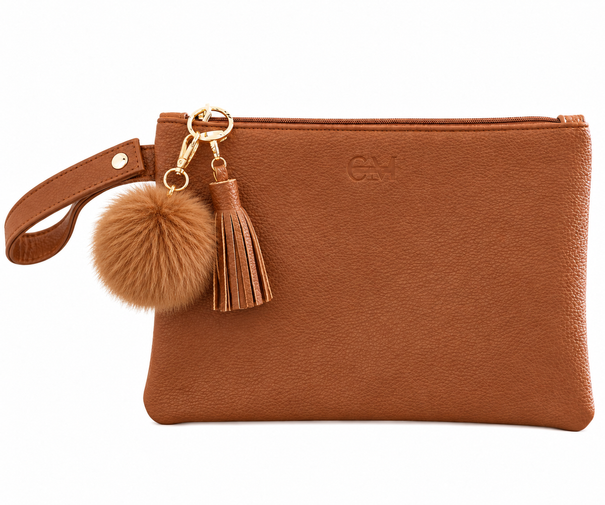 Coco Mae Coco Brown bag charm on a Tan Tassel Clutch