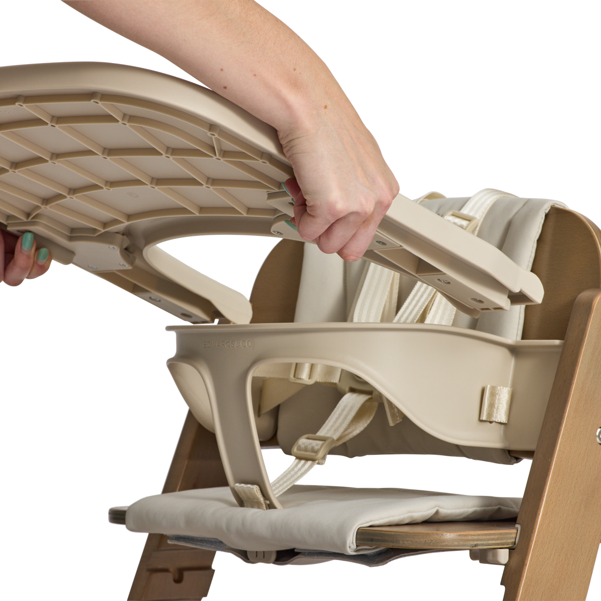 Removing the tray and saddle from the Cariboo Frankie Highchair in Walnut for cleaning
