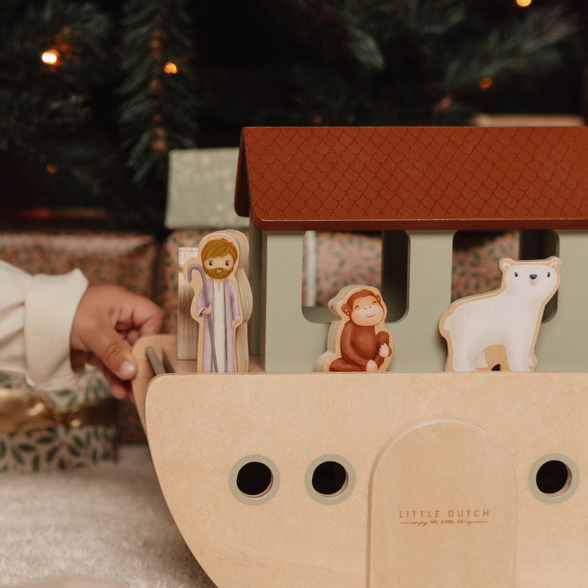 Noah and animals loading onto the wooden ark