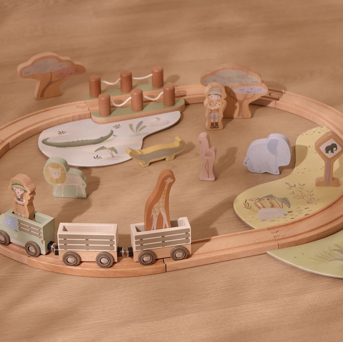 Children playing with the wooden train set