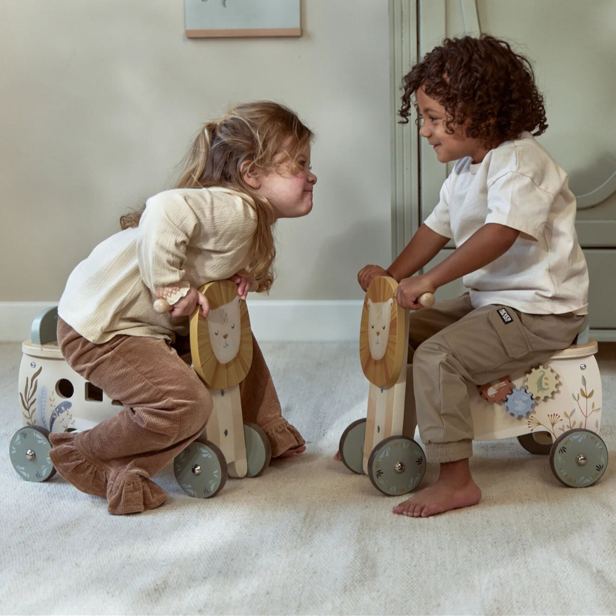 Toddler riding the Little Dutch ride-on lion