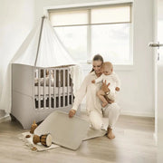 classic baby cot design suitable from newborn through toddler years
