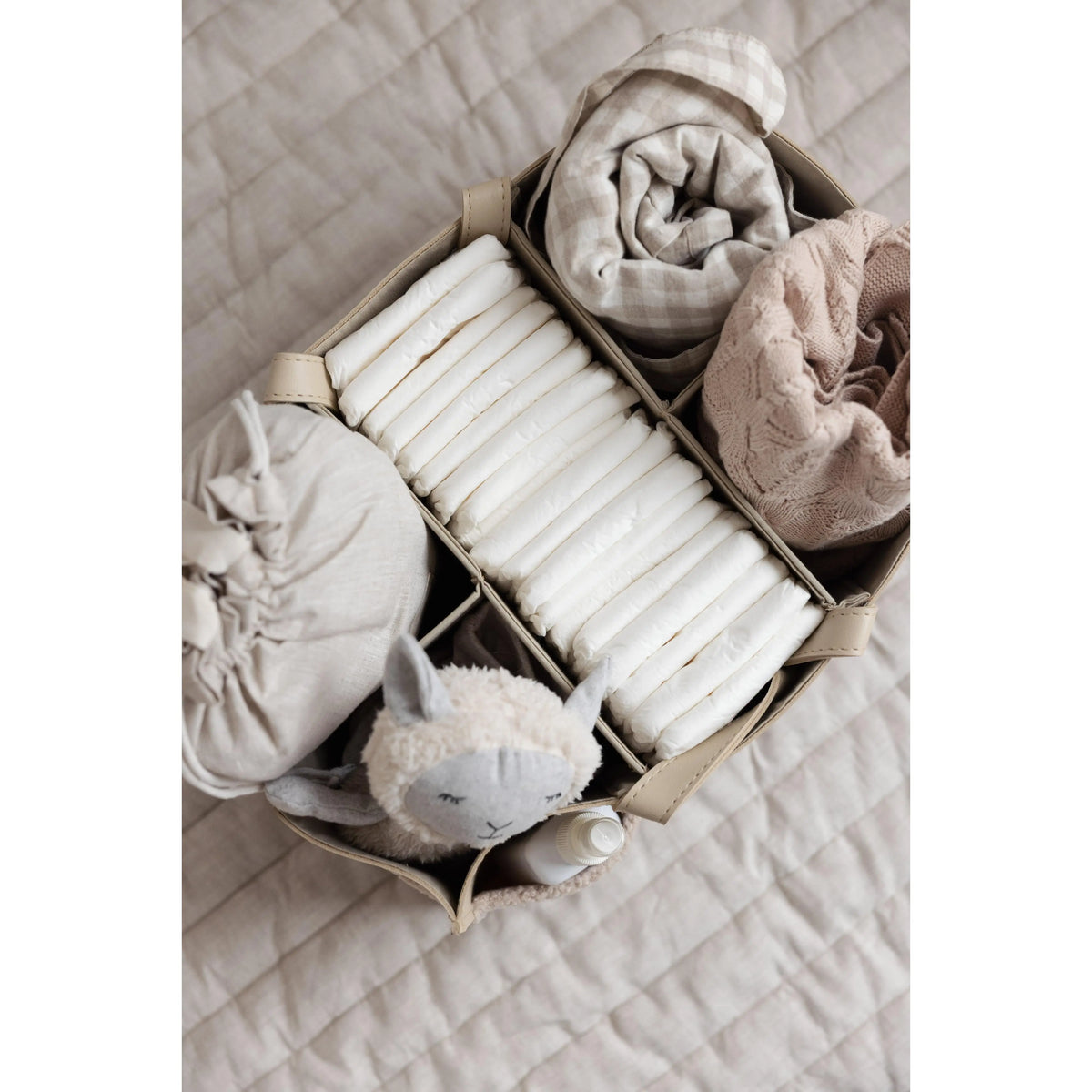 Linen Label Luxe Nappy Caddy in Nude packed with nursery essentials