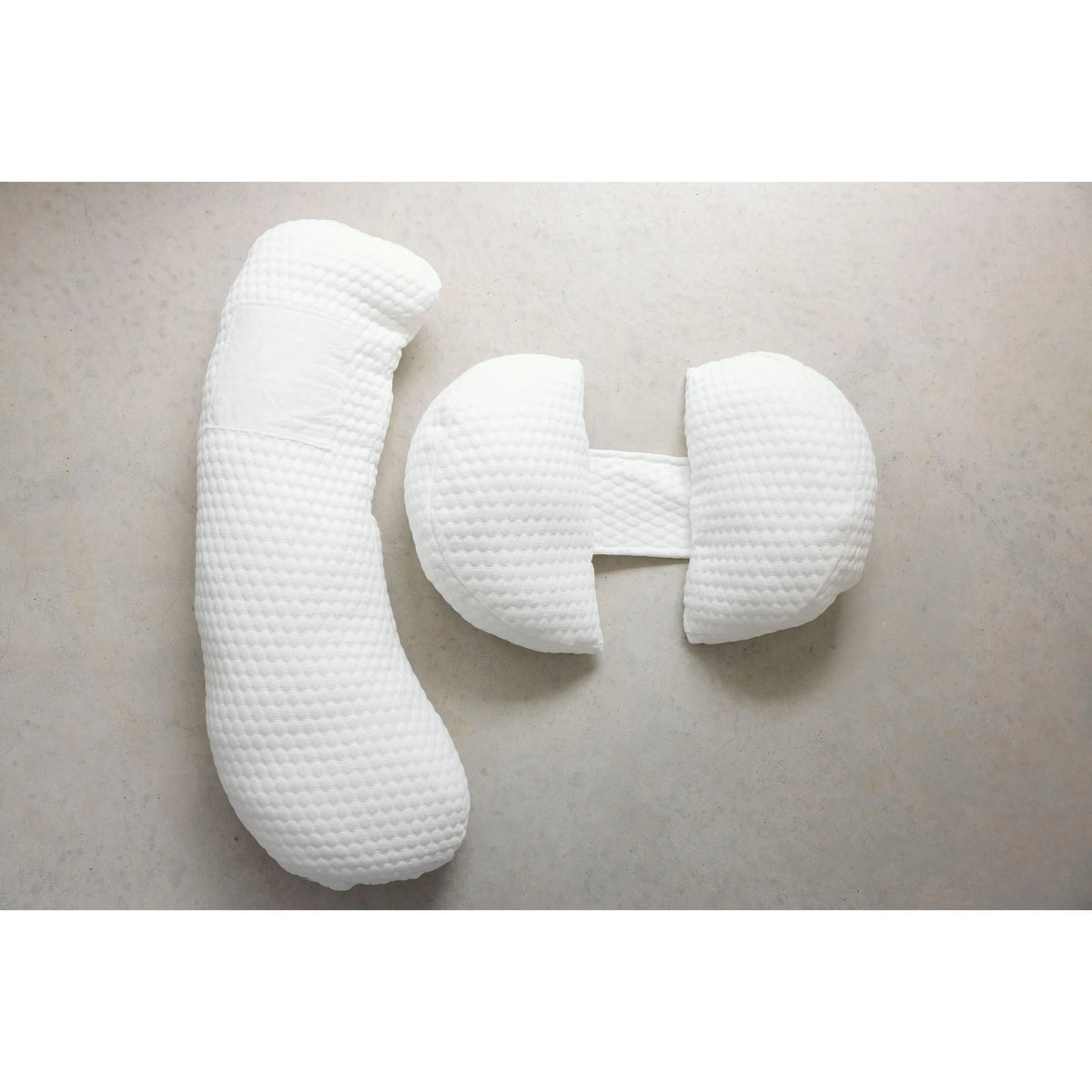 Linen Label large maternity pillow shown supporting bump and knees