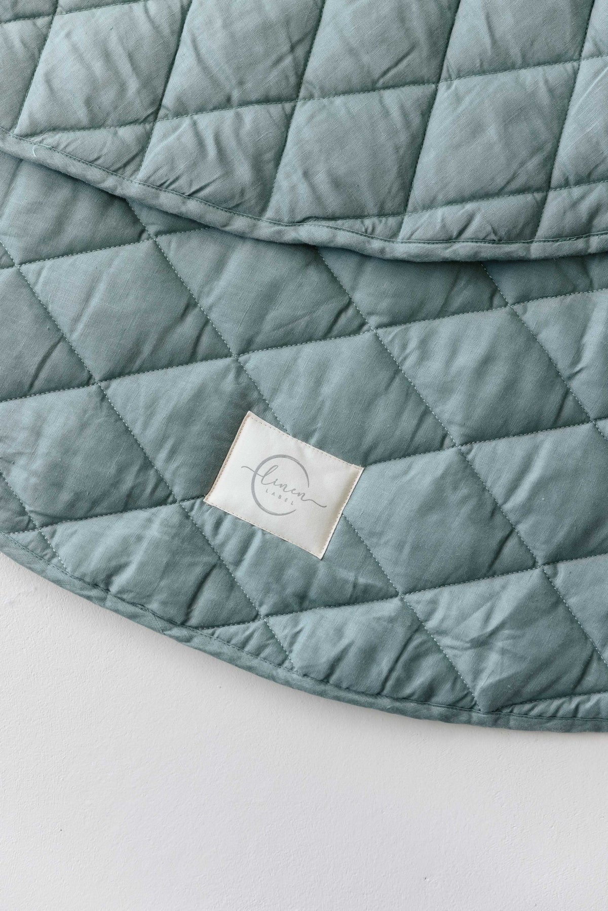 Linen Label padded linen play mat in Opal Sage