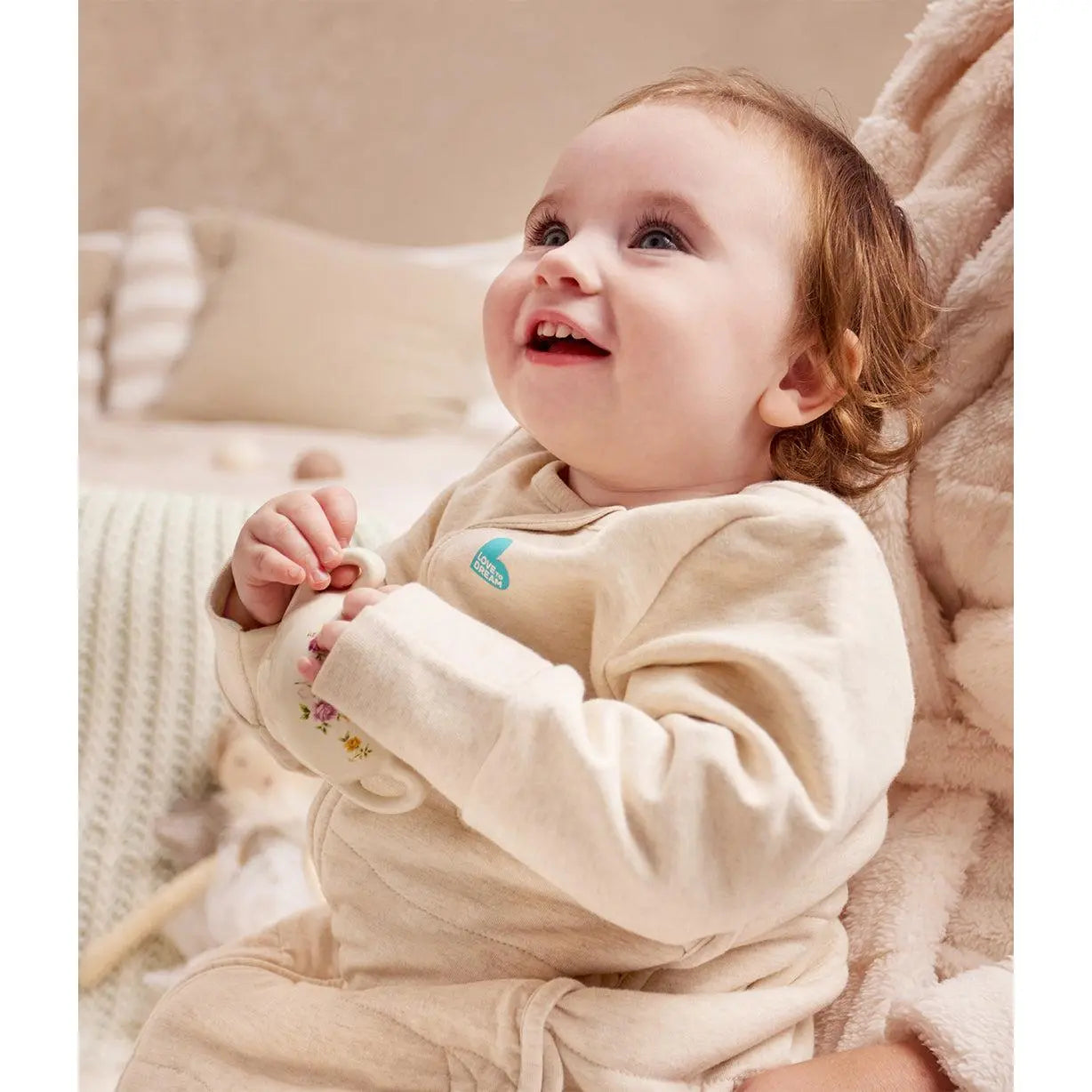 Baby asleep in Love to Dream Sleep Bag Long Sleeve 3.5 TOG Oatmeal Moon Quilting