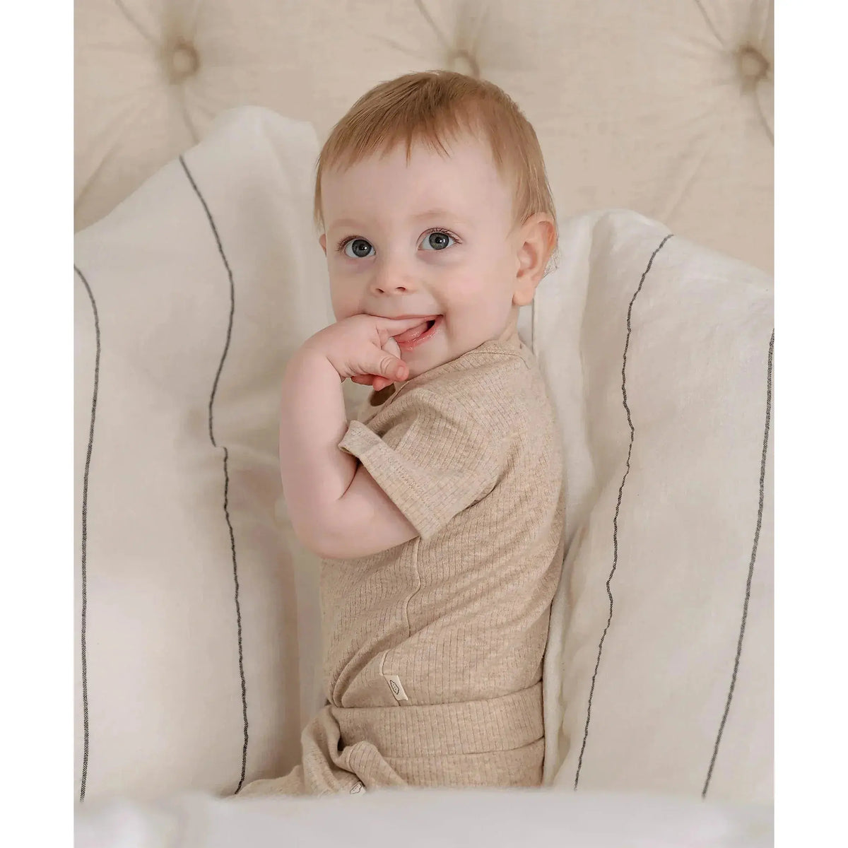 Lummi in Colour Heather Oat bodysuit showing the stud gusset