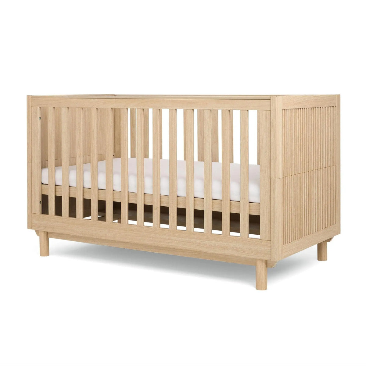 Oska Cotbed oak styled in a Scandinavian nursery