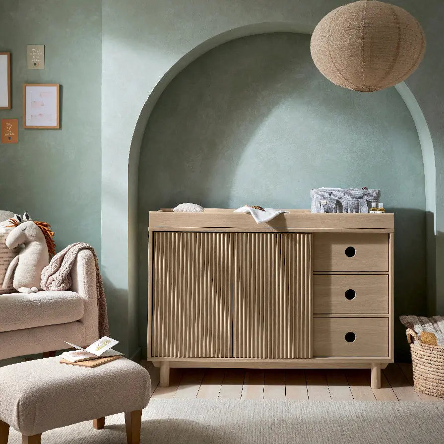Oska wide dresser changer oak in a nursery with natural textures