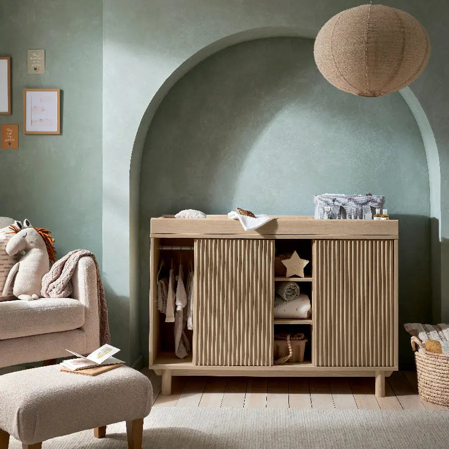 Oska wide dresser changer oak shown alongside the Oska cotbed