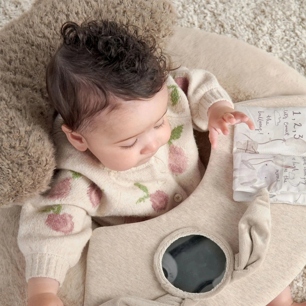 Mamas & Papas Sit & Play floor seat in Welcome to the World Millie & Boris, baby playing with the activity tray, seen from above