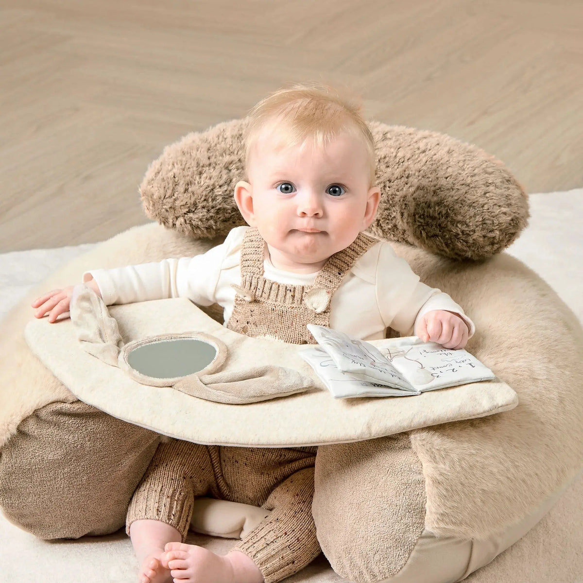 Mamas & Papas Sit & Play floor seat in Welcome to the World Millie & Boris, baby sitting in the seat, front view