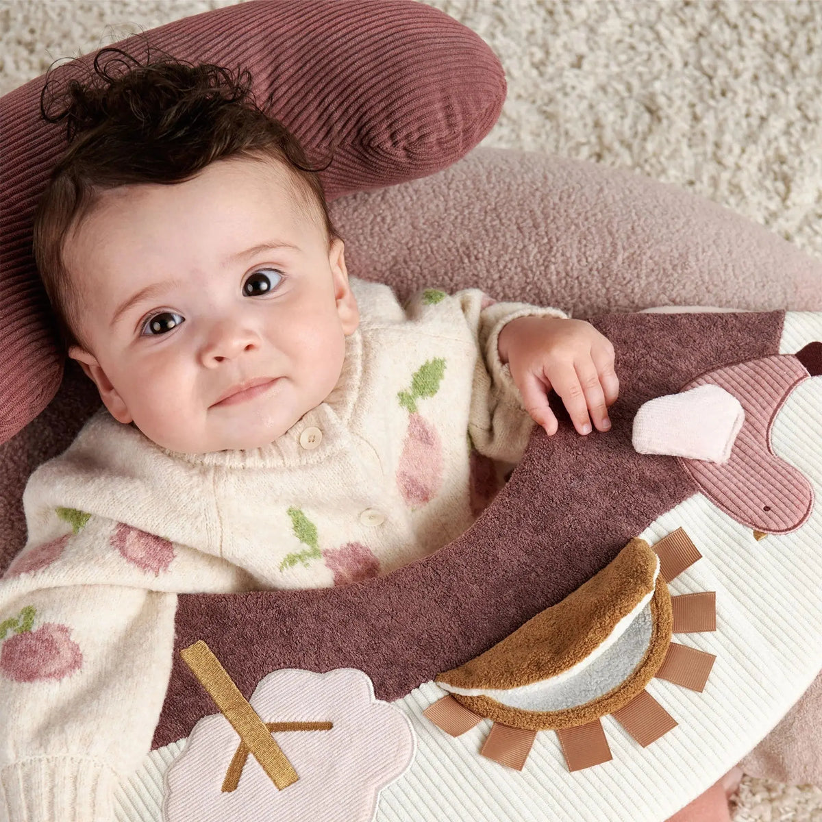Mamas & Papas Sit & Play floor seat in Welcome to the World Floral, baby sitting in the seat, close-up
