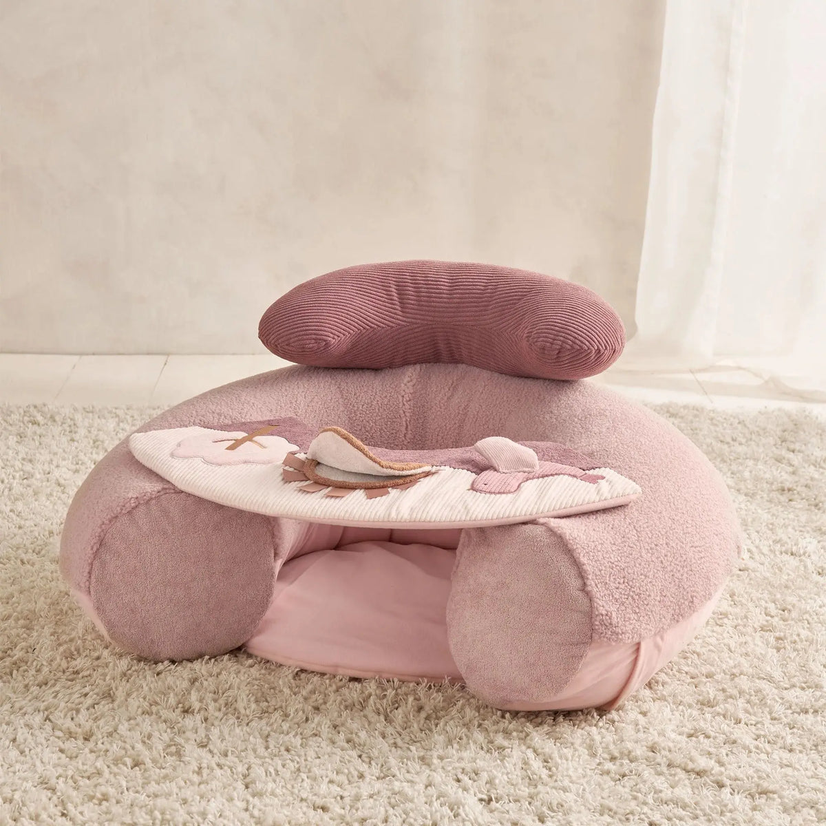 Mamas & Papas Sit & Play floor seat in Welcome to the World Floral, floor seat on a rug, three-quarter view