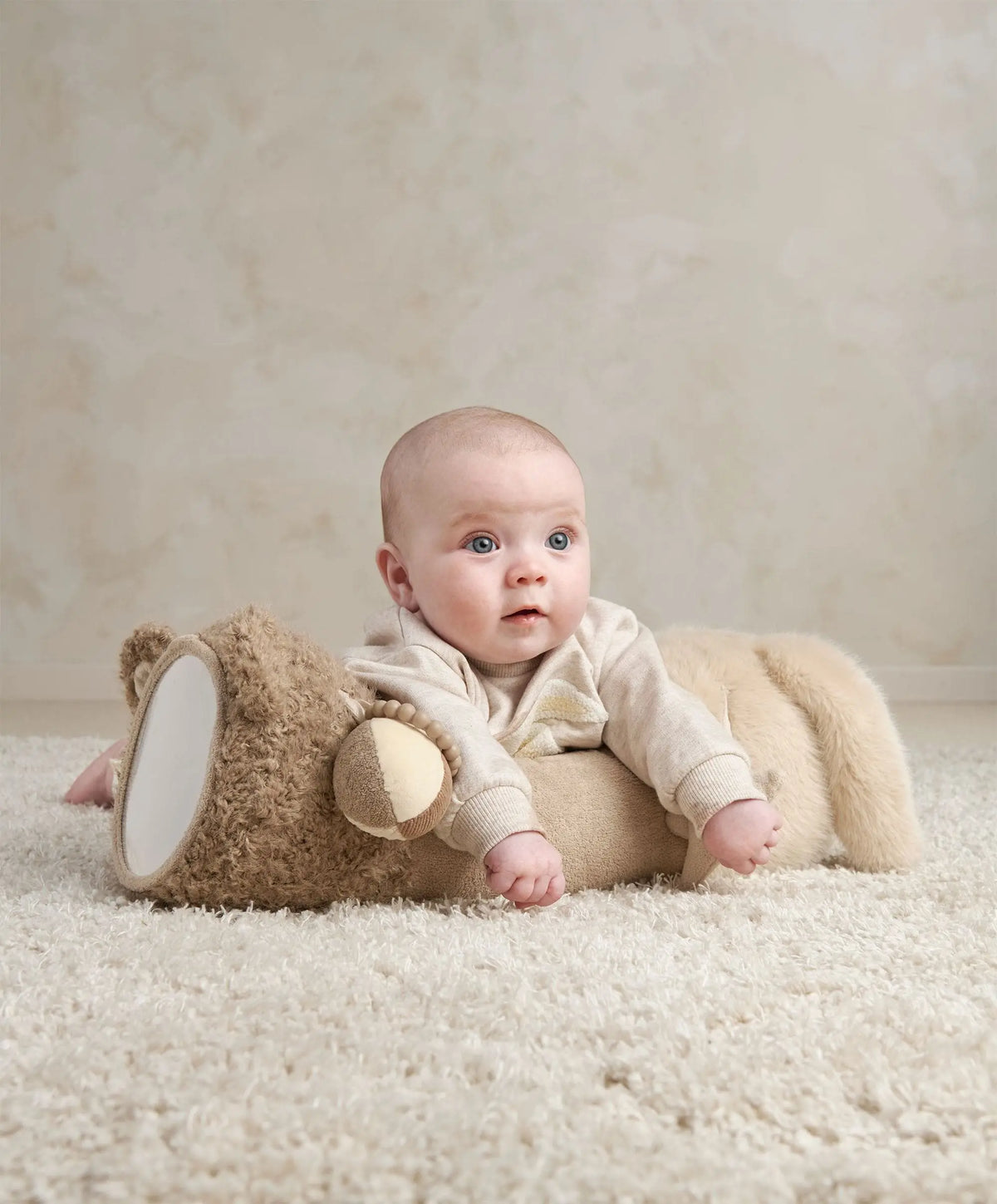 Baby doing tummy time on the Millie & Boris tummy time roll