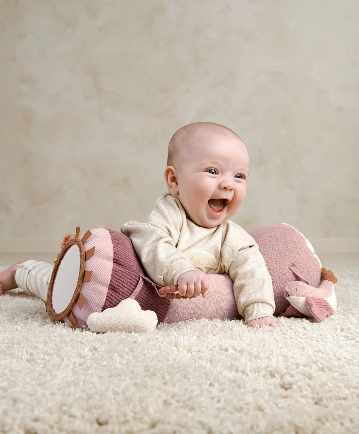 Baby doing tummy time on the Floral tummy time roll