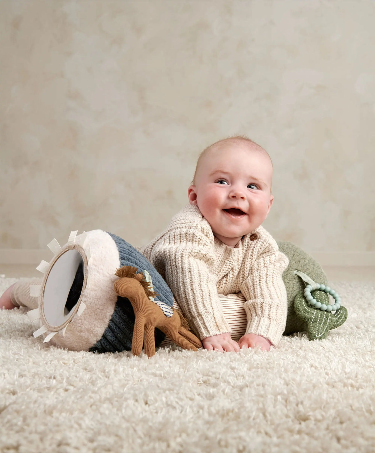 Baby doing tummy time on the Pony Express tummy time roll
