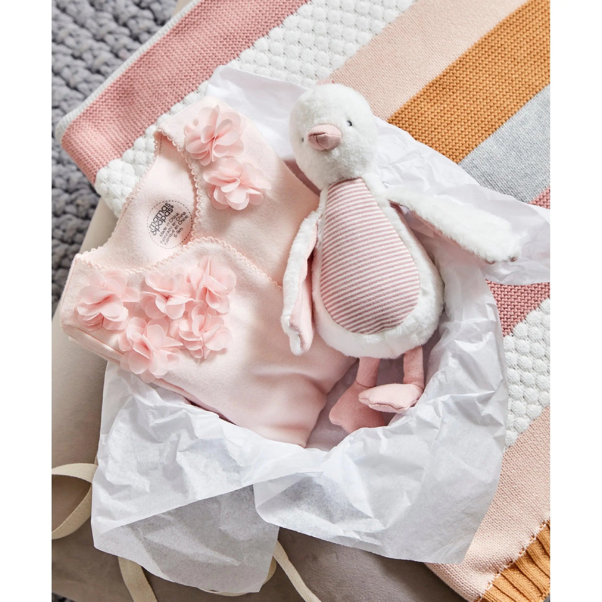 WTTW Chime Duck Pink — styled on pram bar, soft fabric with chime bell, Mamas & Papas