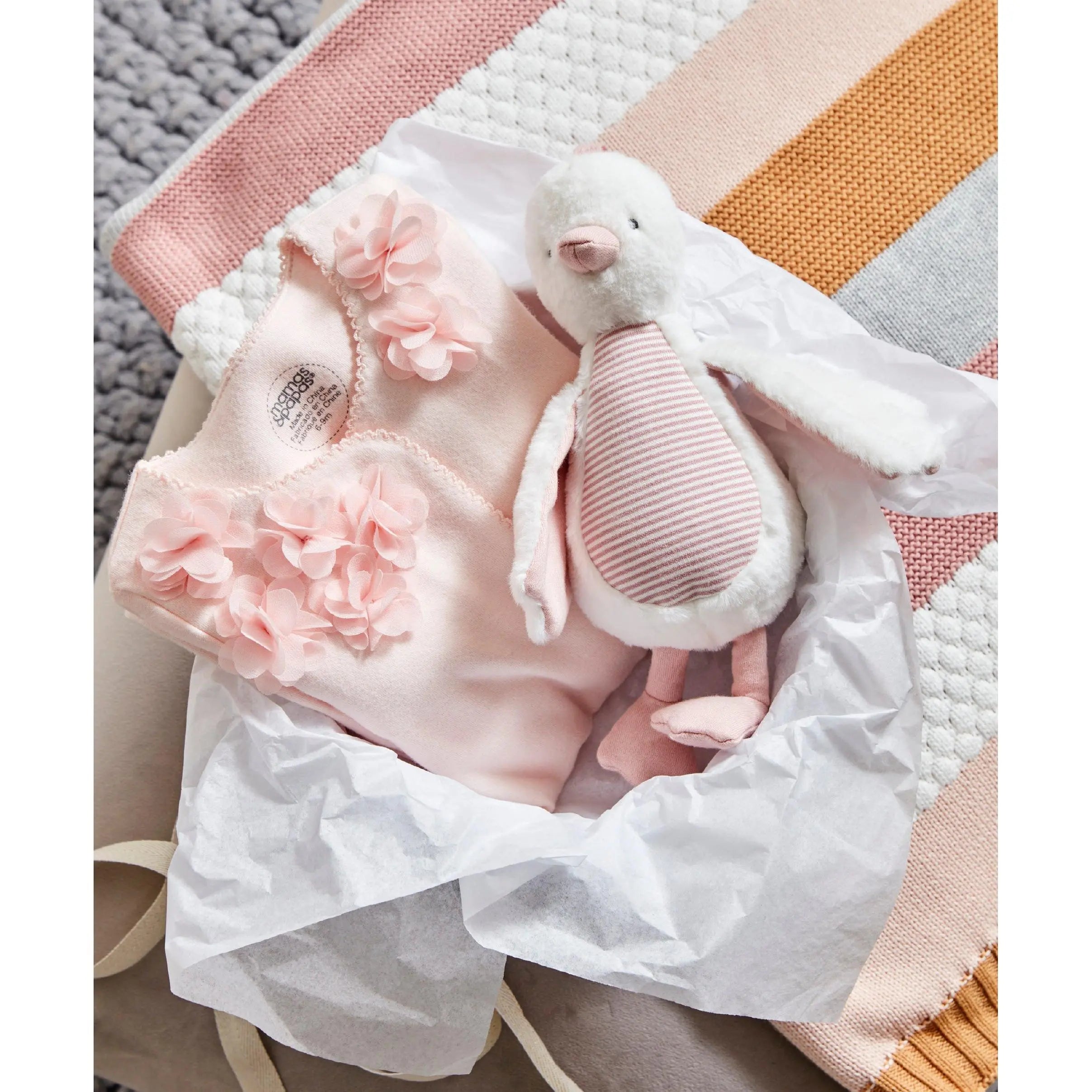 WTTW Chime Duck Pink — styled on pram bar, soft fabric with chime bell, Mamas & Papas