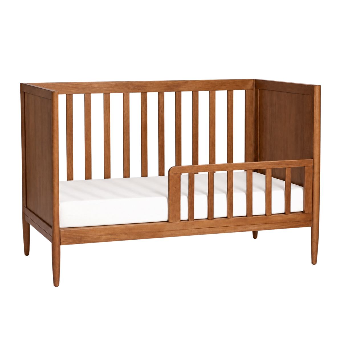 Cariboo Marlow Cot converted to a toddler bed with the conversion kit in walnut