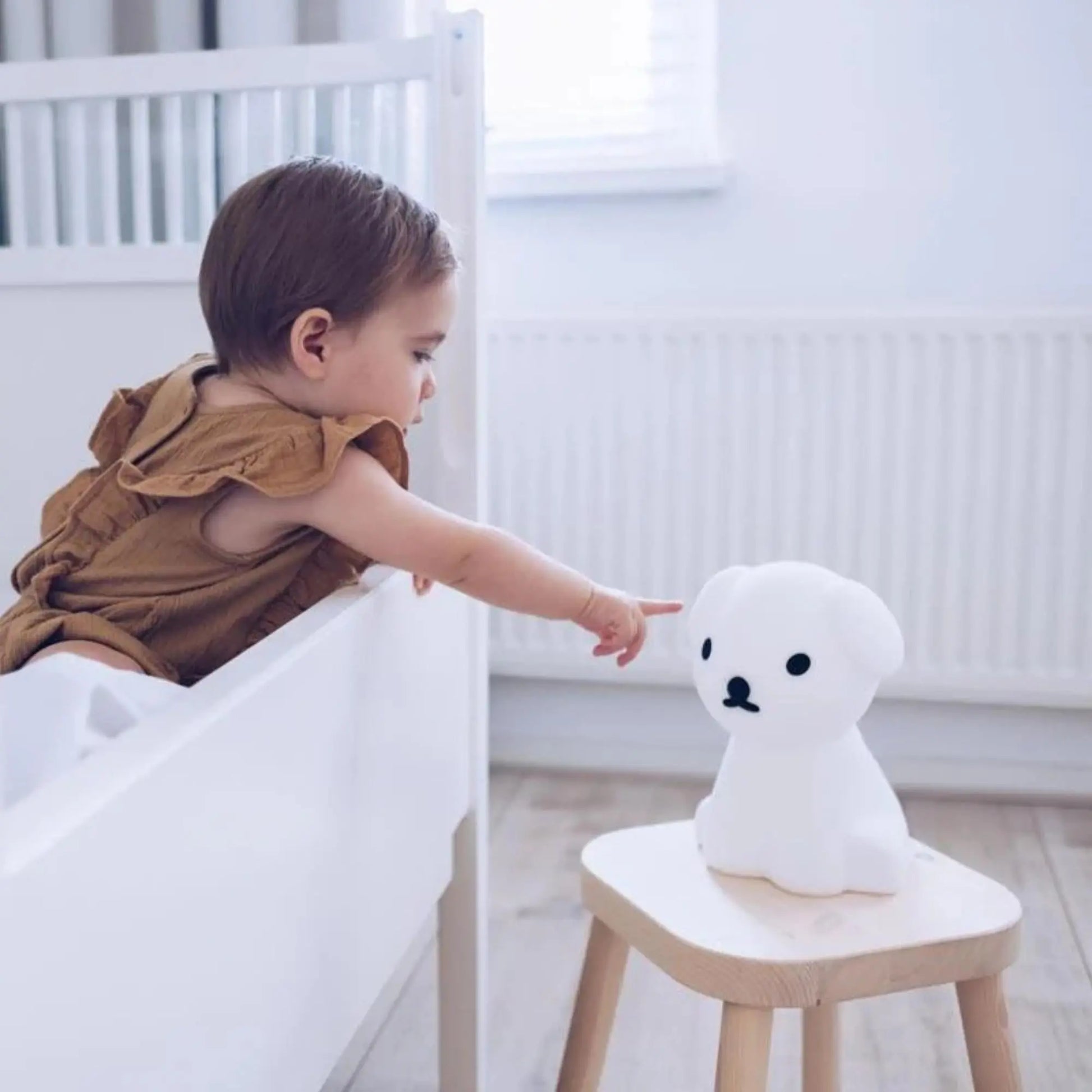 Snuffy First Light styled on nursery shelf — Mr Maria wireless rechargeable lamp