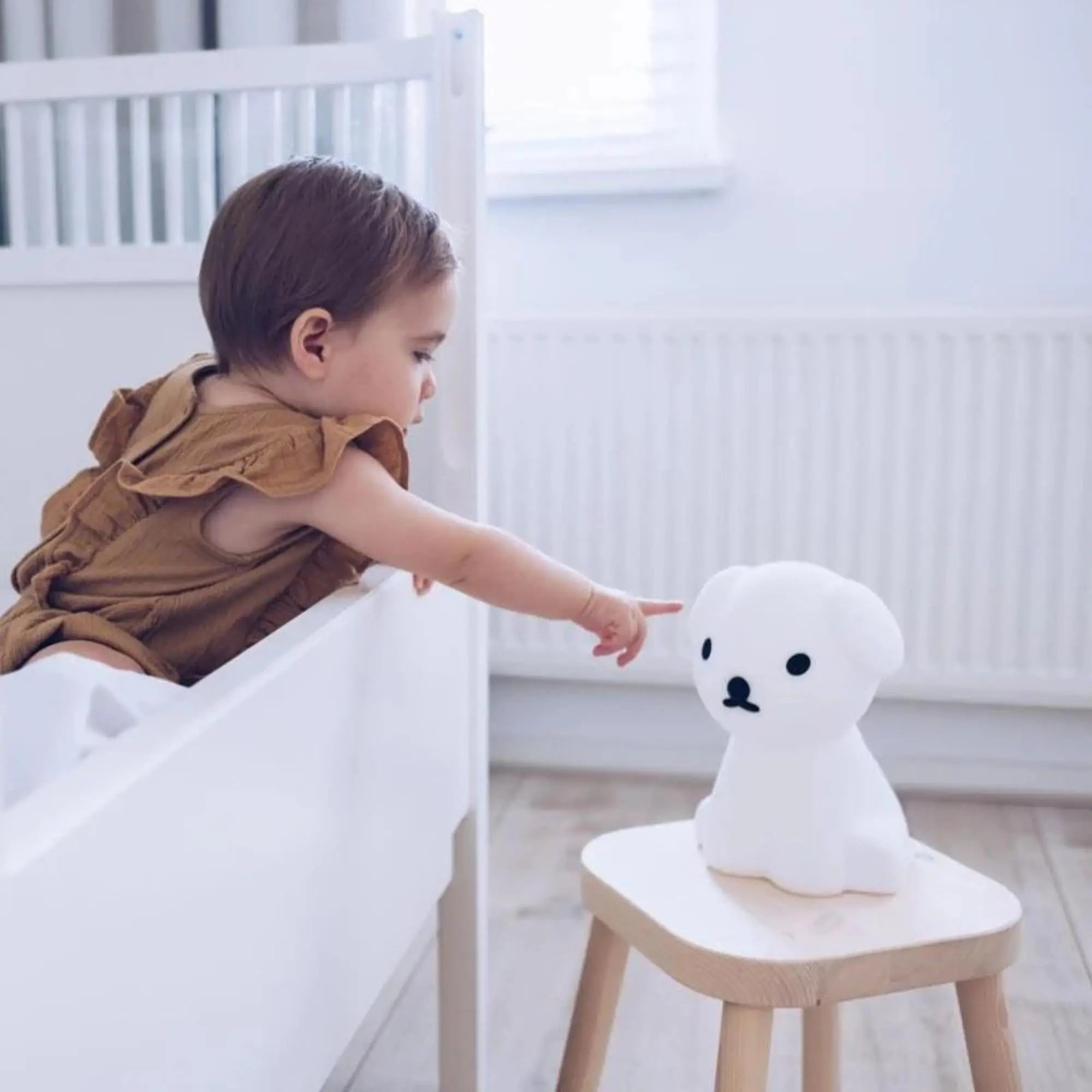 Snuffy First Light styled on nursery shelf — Mr Maria wireless rechargeable lamp