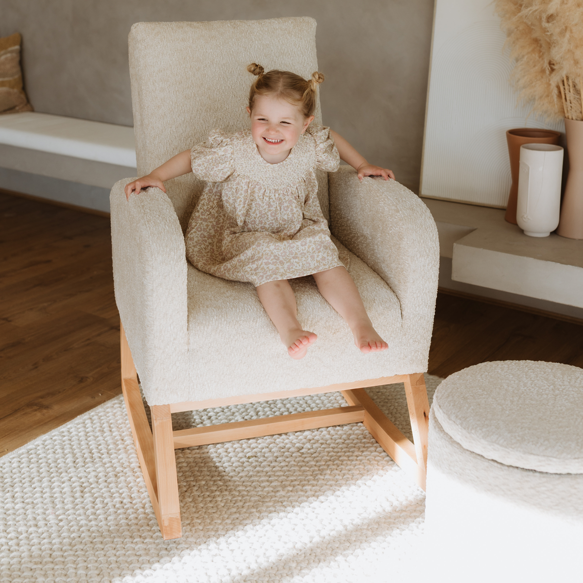 Child sitting in the Cariboo Myla chair as a living room accent chair