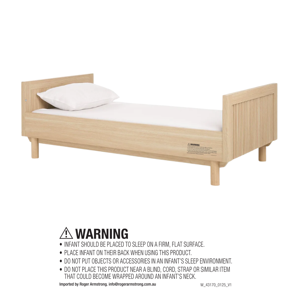 Oska Cotbed converted to a toddler bed in oak