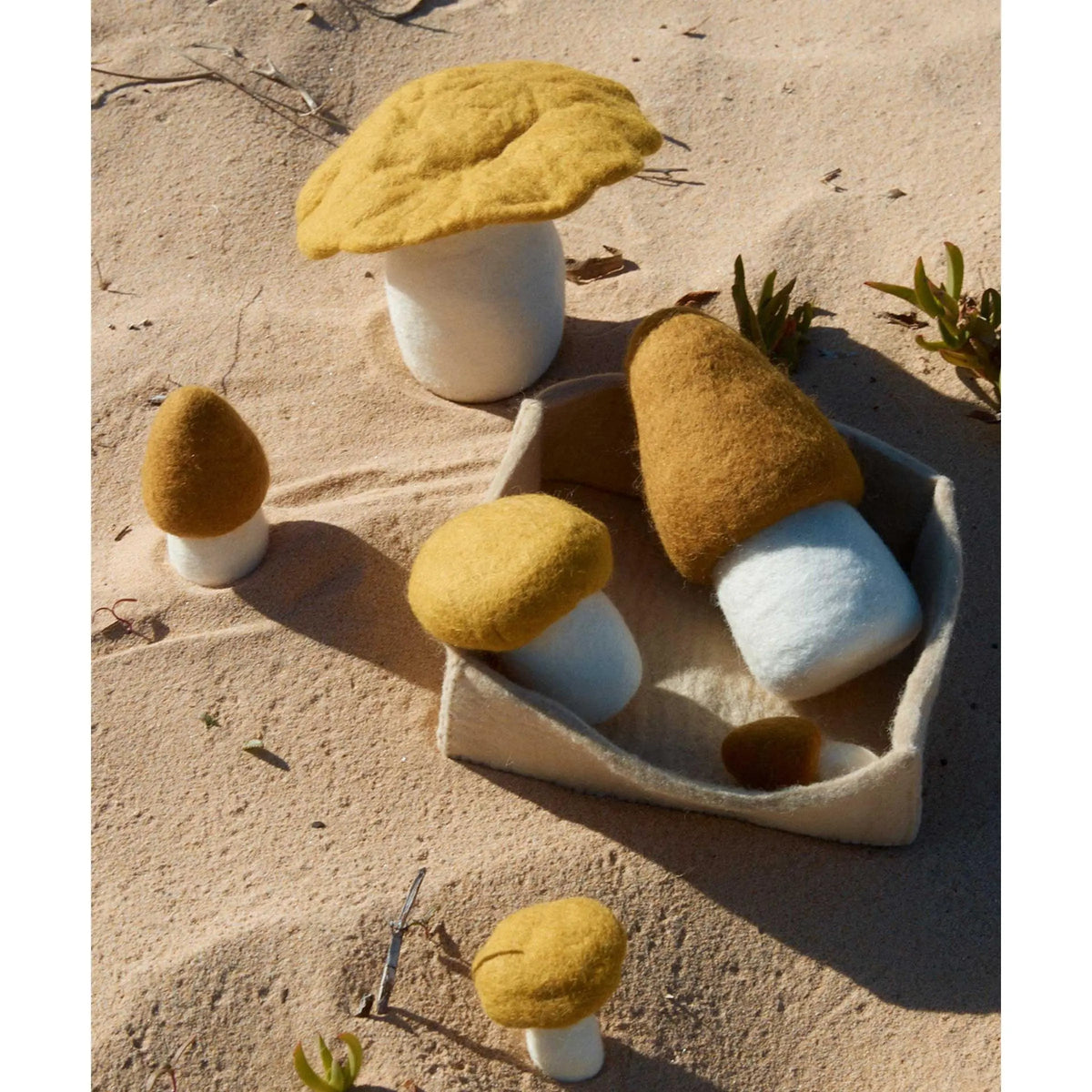 Handmade Phile felt mushroom toys shown with other felt play food
