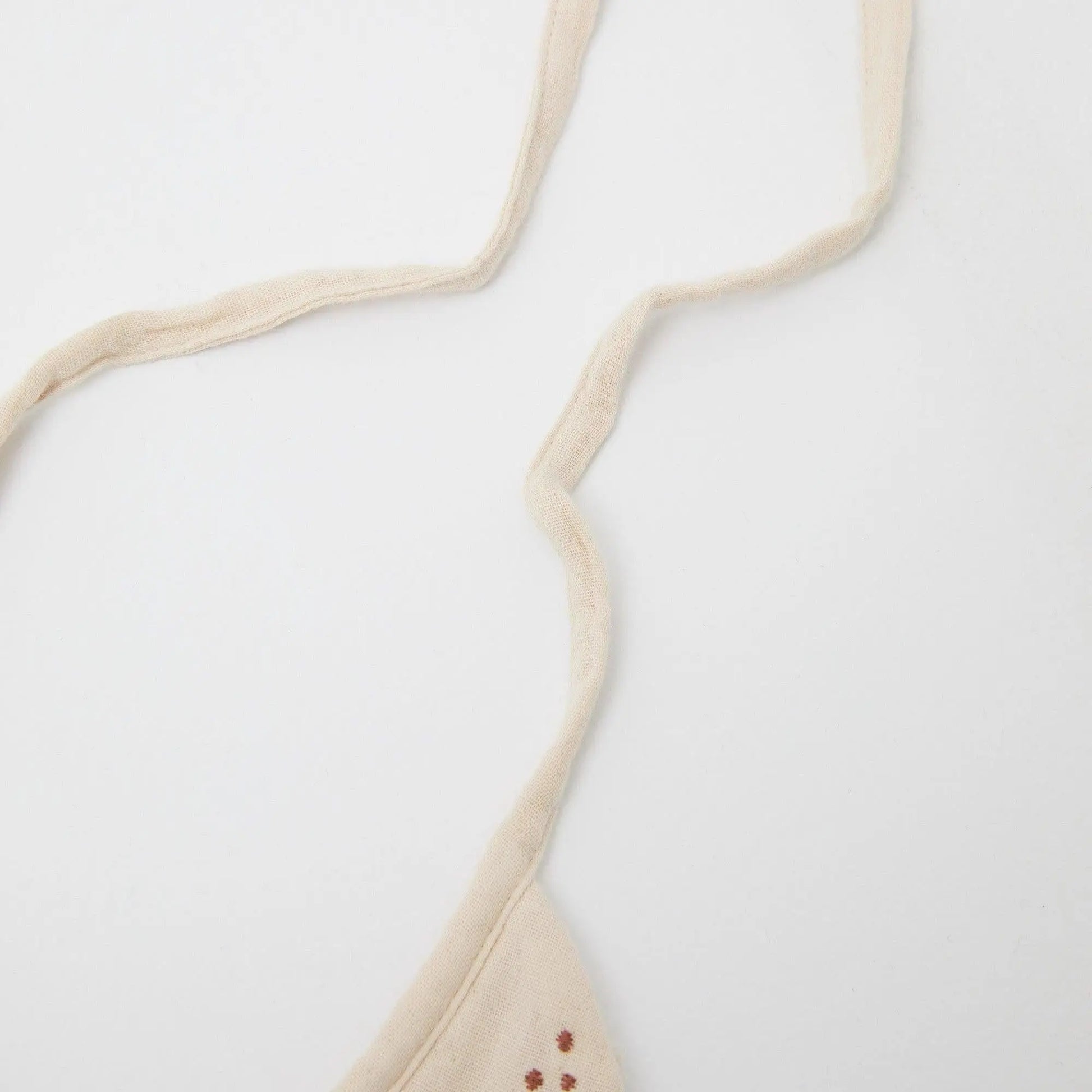 Phile Embroidered Bib