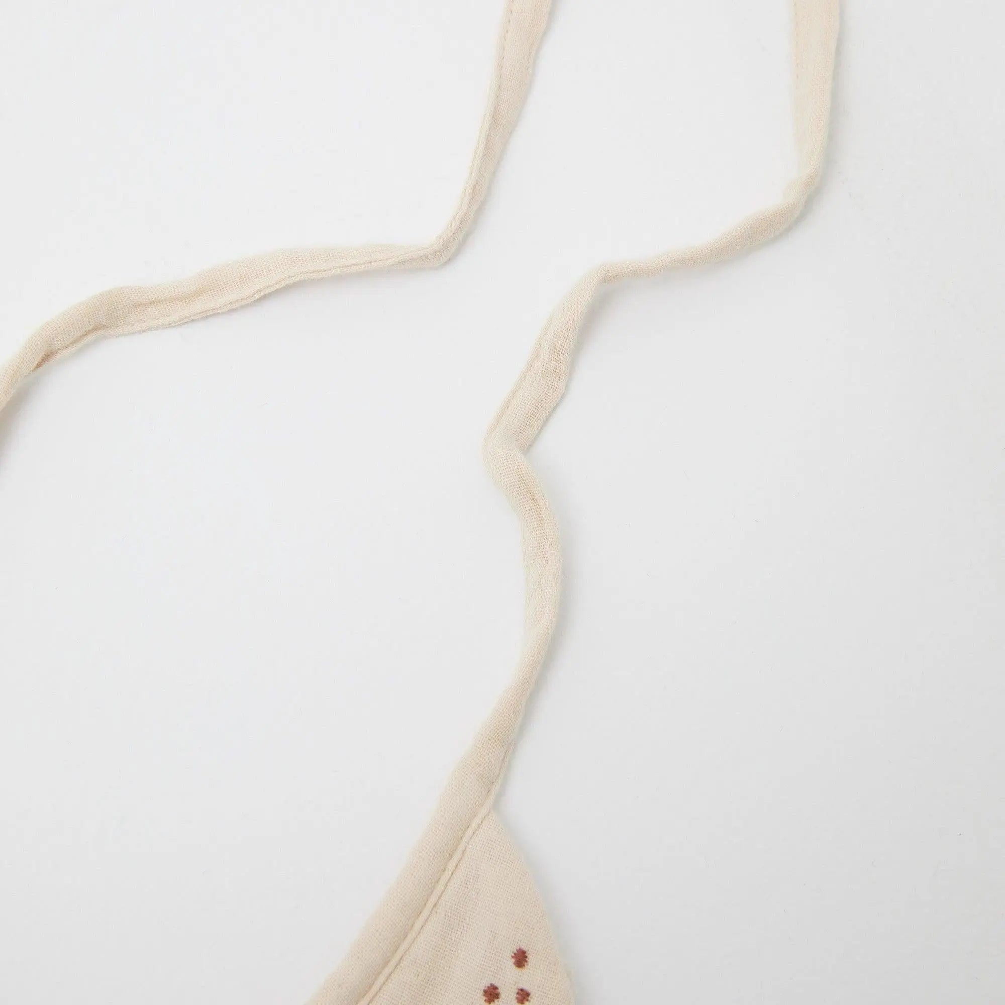 Phile Embroidered Bib