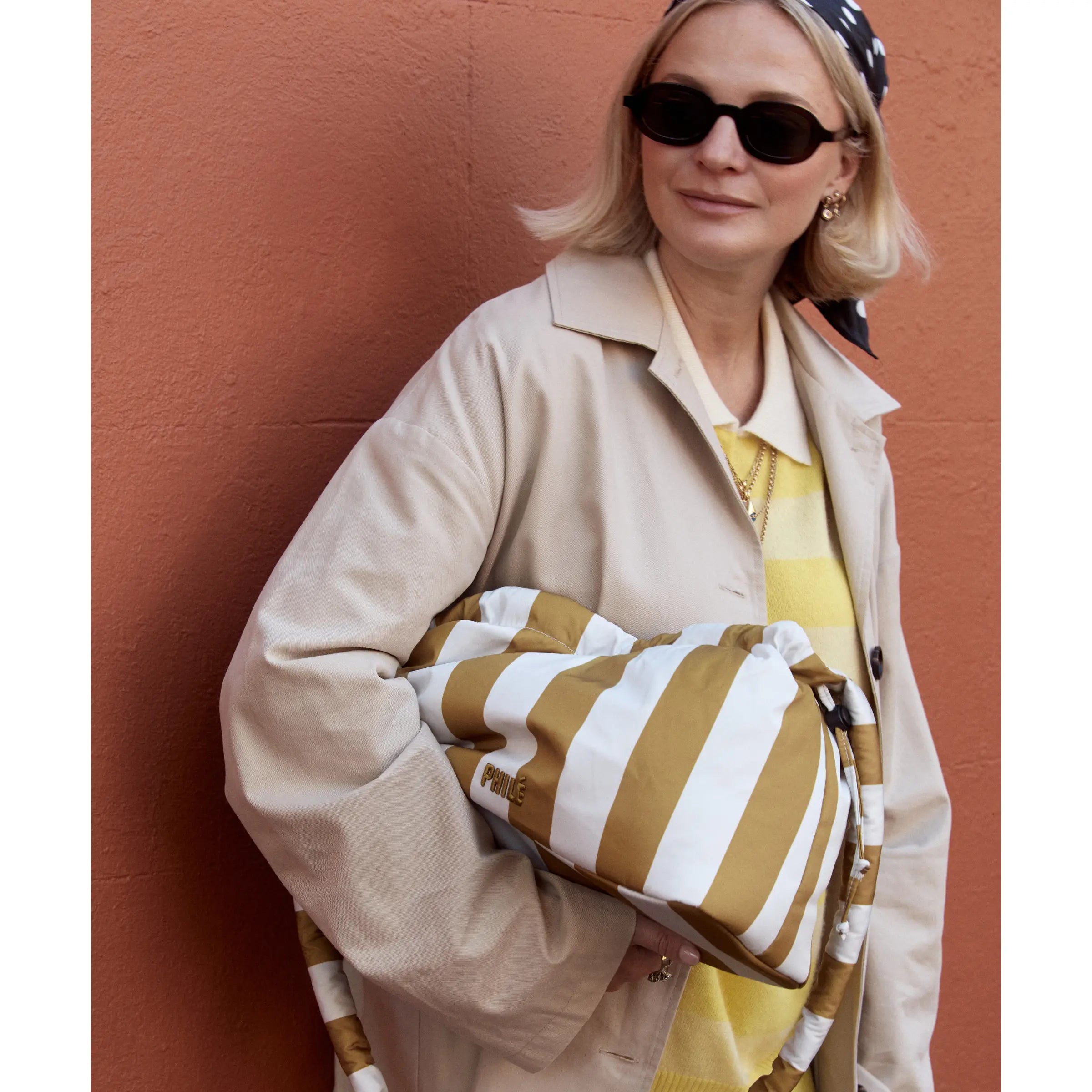 Philé Pram Caddy in Gold Stripe, close-up of recycled nylon fabric