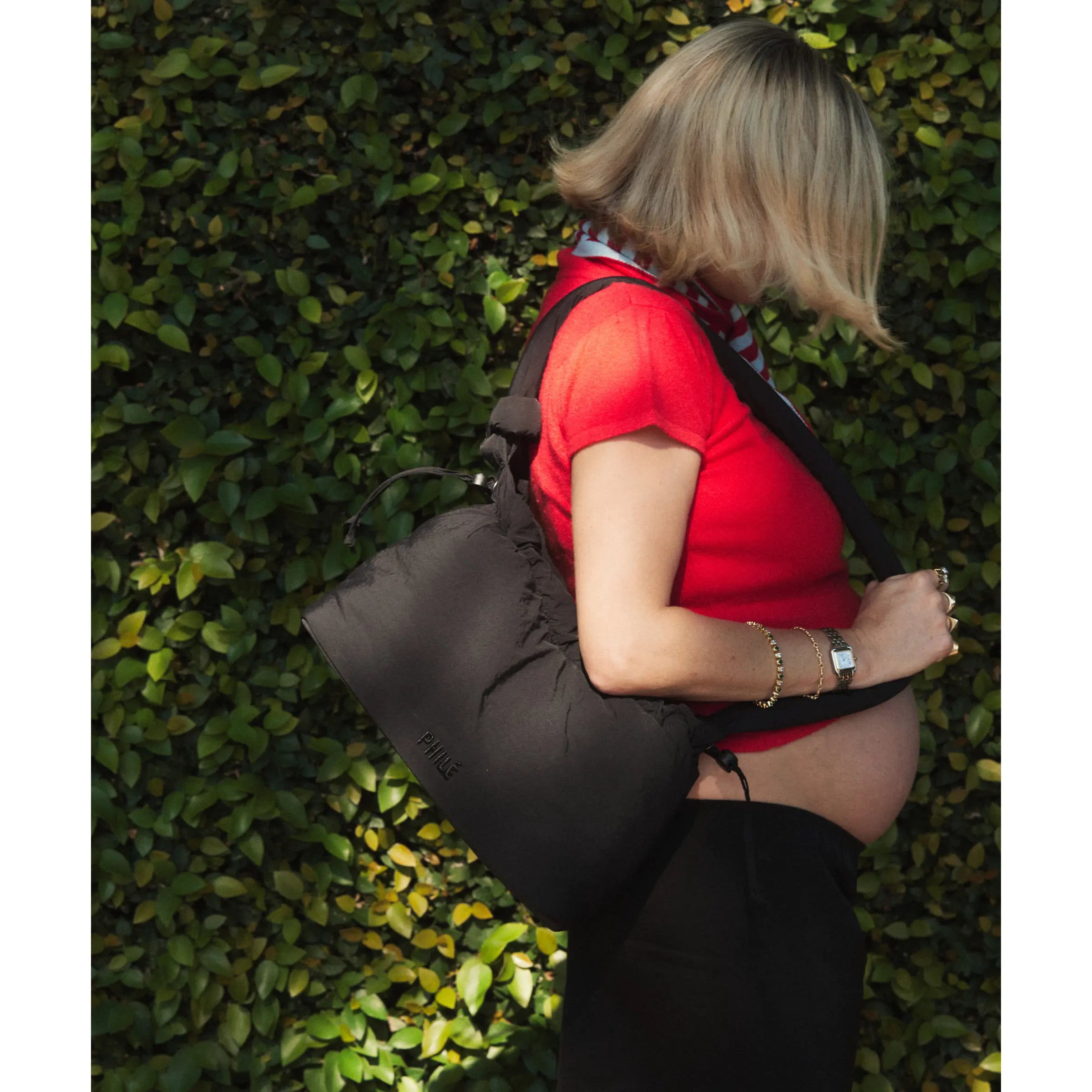 Philé Pram Caddy in Black, lifestyle shot on pram
