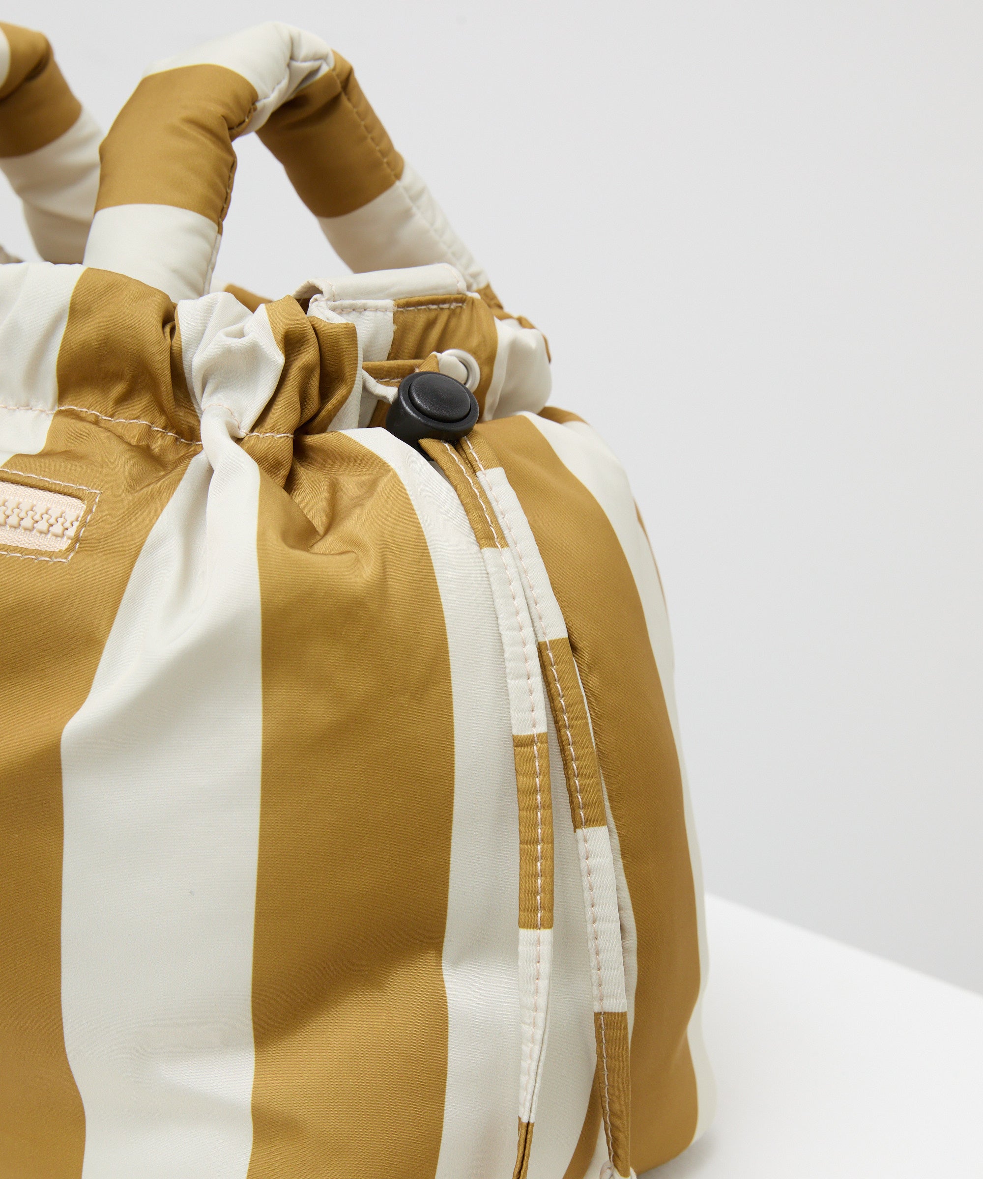 Philé Pram Caddy in Gold Stripe, thermal bottle holder