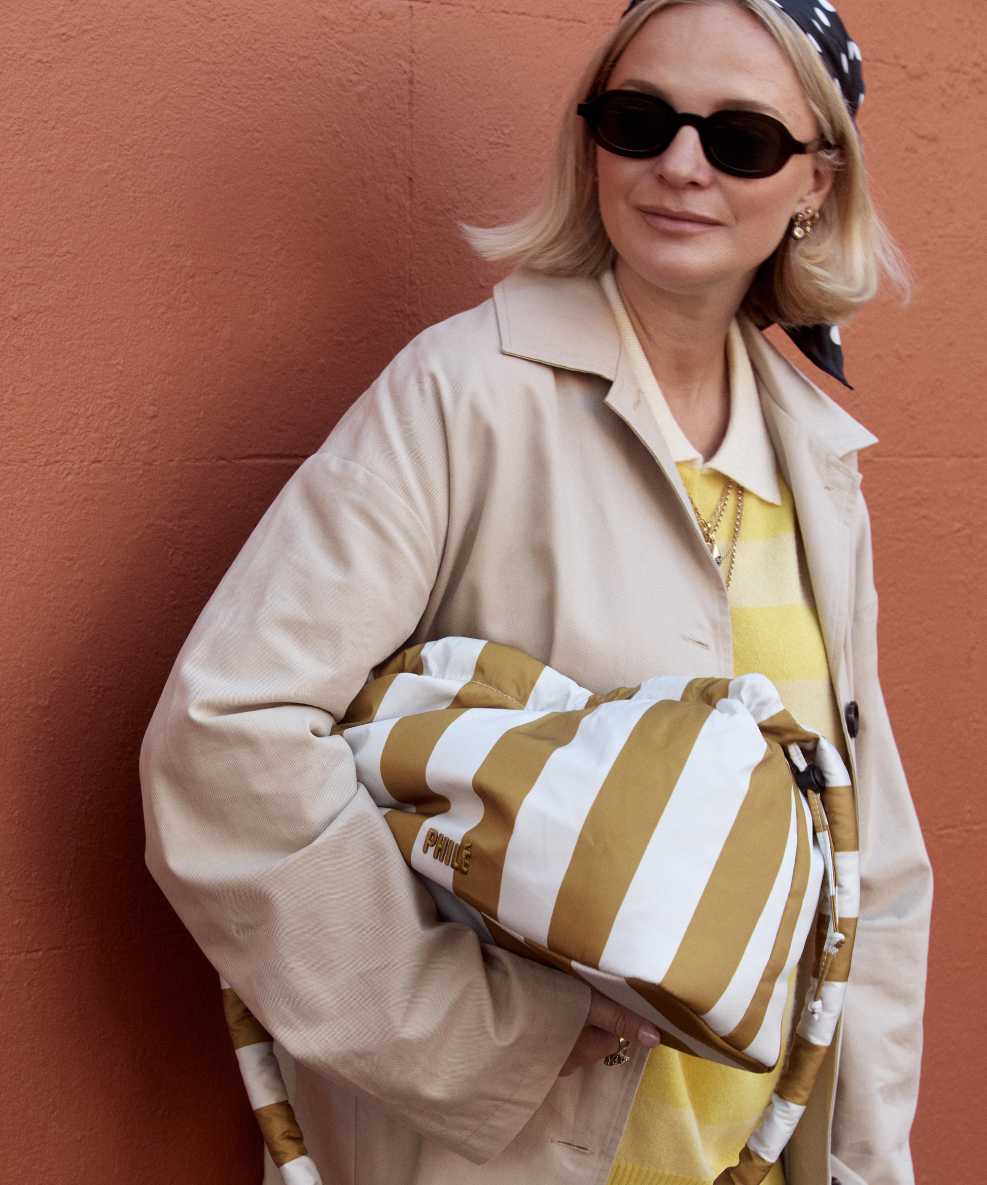 Philé Pram Caddy in Gold Stripe, close-up of recycled nylon fabric