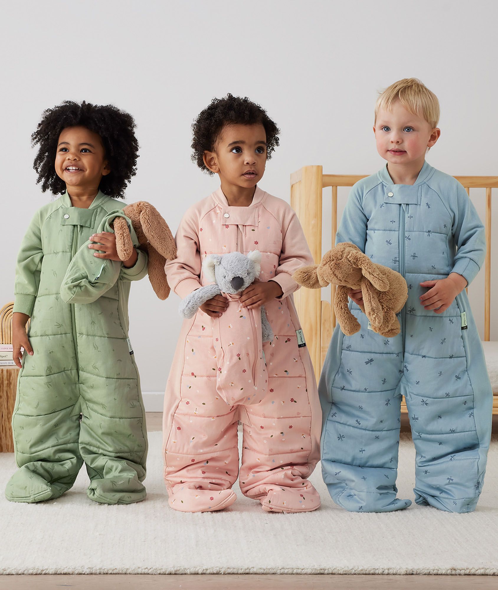 Toddler in the ergoPouch Sleep Suit Bag from the Heritage collection at bedtime