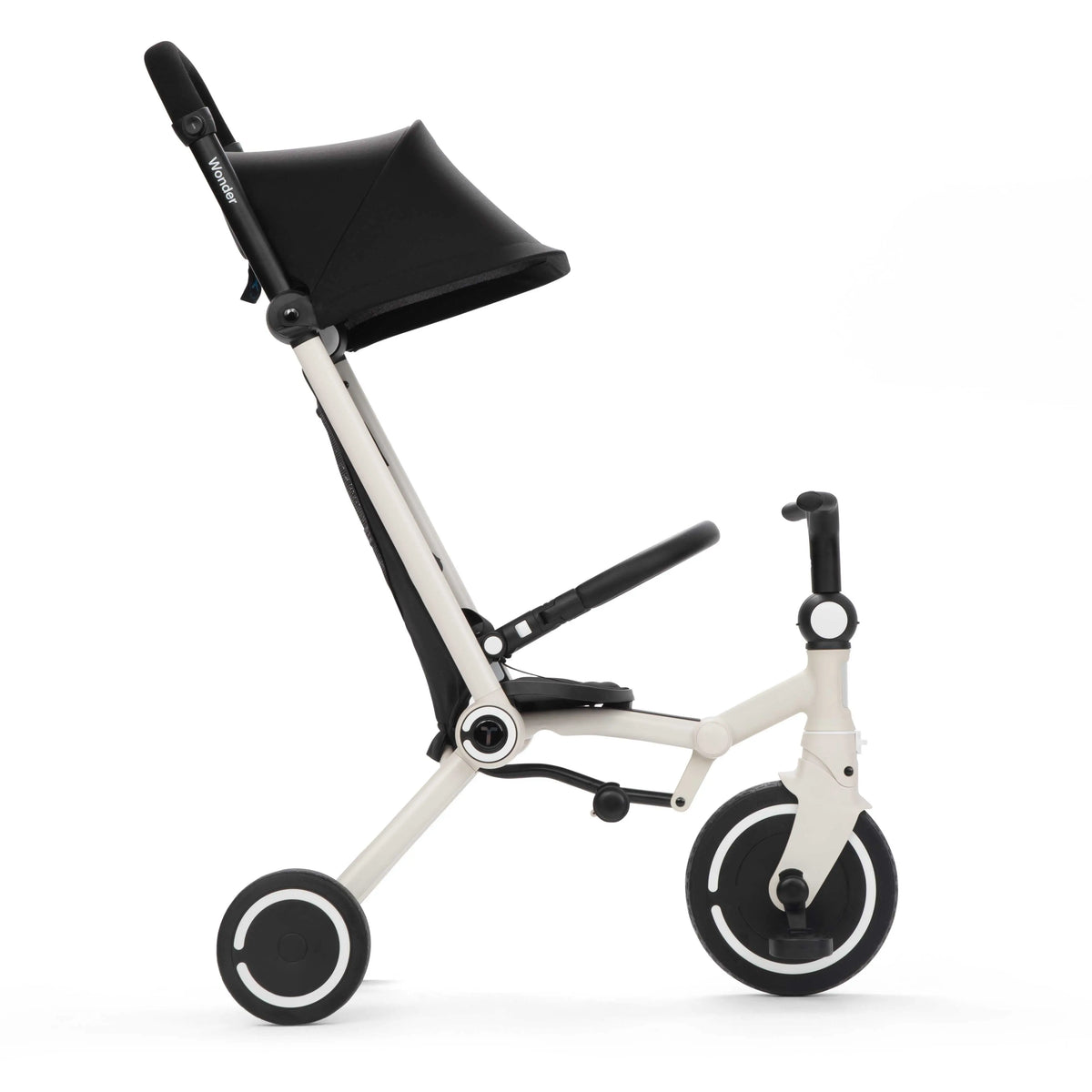 smarTrike Wonder Moonlight in trike mode, child holds handlebars while parent steers